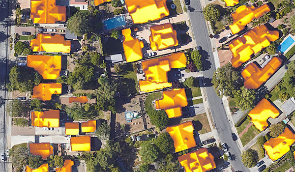 Aerial view of homes with solar potential mapped on rooftops